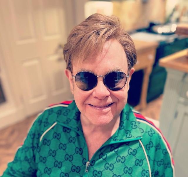 Elton John wearing dark shades