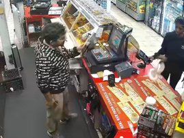 Suspects holding python in store