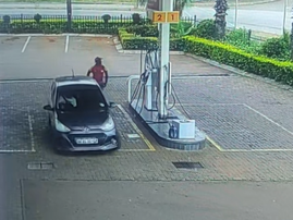 A dark grey Hyundai drives off from the petrol station without paying