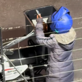 A delivery driver seen eating chips out of customer food order