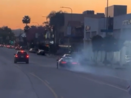 A driver doing donuts with a McLaren Senna on the streets of Los Angeles