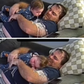 A father laughs as his baby pukes on him