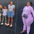 A group riding a fun fair ride looking scared