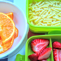 A homestyle school lunch with pasta and fruit