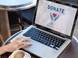 A person choosing a charity to donate to online