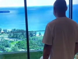 A tourist looking out at an artificial sea view
