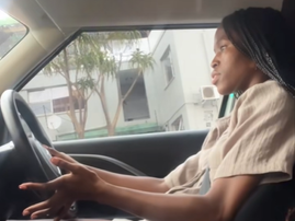 A young woman driving her car