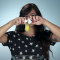 Woman cracking an egg into a bowl