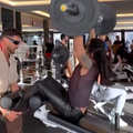 Lenny Kravitz pumping iron wearing leather pants