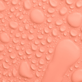 Peach coloured background with water drops