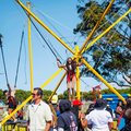 People enjoying themselves outdoors at a picnic and jump trampoline activity