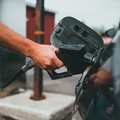 Person filling petrol in car
