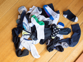Pile of lost socks lying on the floor