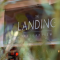 The entrance sign to The Landing Coffee Shop in Edenvale
