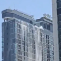 Water cascading off the side of a hotel in Thailand during the earthquake